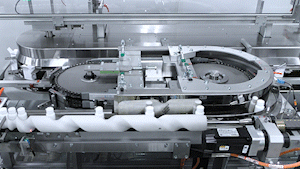 Vitamin bottles into a vertical cartoner